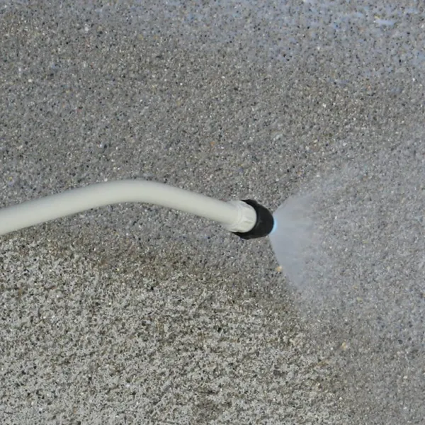 Applying a protective coating to a concrete surface, preventing damage and enhancing durability.